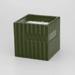 Zielona świeca w kwadratowej ceramicznej podstawce